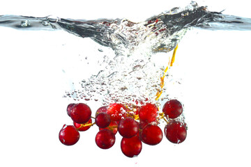 Fototapeta na wymiar Red grapes in water. Grapes in water splashes isolated. Red Grapes Splashing Into Water on white blackground