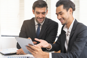 Business people meeting. Businessman, partnership planning strategy of project, brainstorming with colleague, using device on tablet, computer analyzing data, discussing document, paperwork at office.