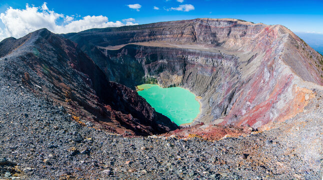 Panorama of Santa Ana volcano crater with turquoise volcanic lake.