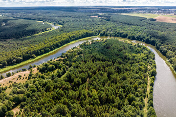 panoramic view from a high altitude of a meandering river in the forest