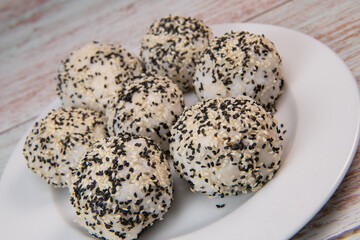 Recipe for sushi ball, rice and tuna, white and black sesame. High quality photo