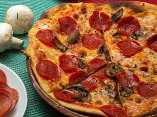 pizza with salami and mushrooms