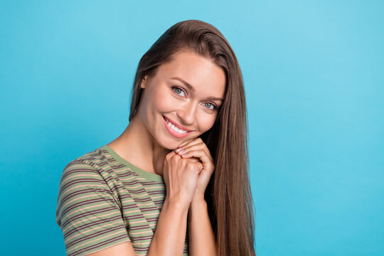 Close up photo of adorable shy lady toothy bright smile salon prosedure dressed striped outfit empty space isolated on blue background
