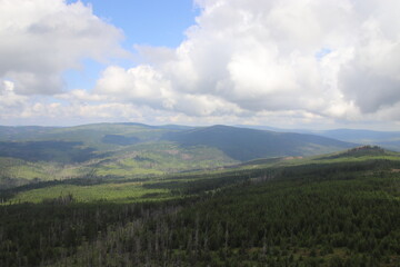 A view to the surrounding landscape with forests and mountains from lookout tower at Polednik, Czech republic