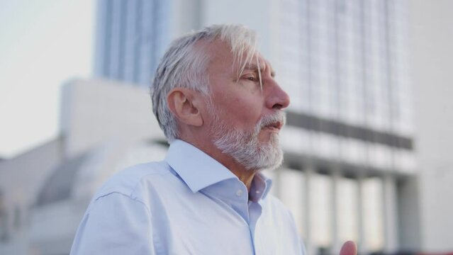 Mature man coughing, chocking with food or drink, risk of asphyxia, call 911