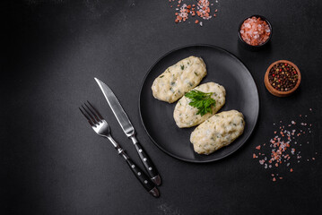Traditional Lithuanian dish zeppelin, boiled potato dumplings stuffed with minced meat © chernikovatv