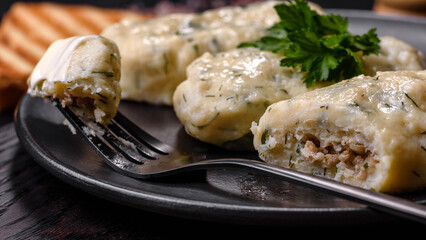 Traditional Lithuanian dish zeppelin, boiled potato dumplings stuffed with minced meat © chernikovatv