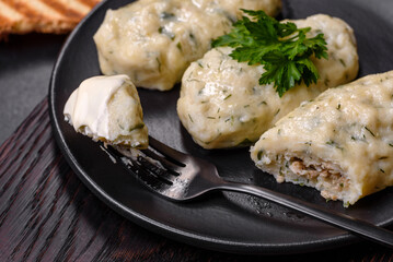 Traditional Lithuanian dish zeppelin, boiled potato dumplings stuffed with minced meat © chernikovatv
