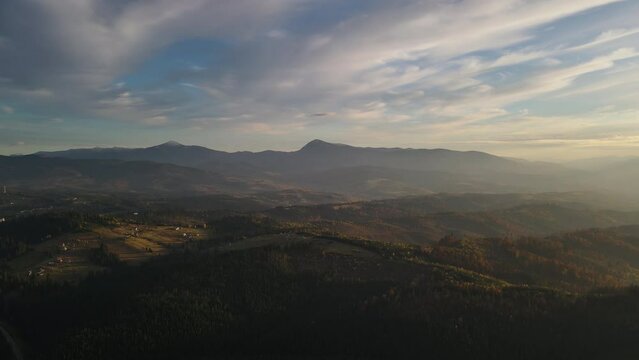Aerial panoramic view of the scenic landscape, drone panning footage over Carpathian mountains in Ukraine
