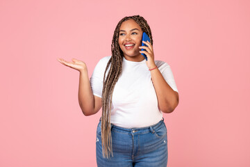 African American Lady Talking On Cellphone Communicating Over Pink Background