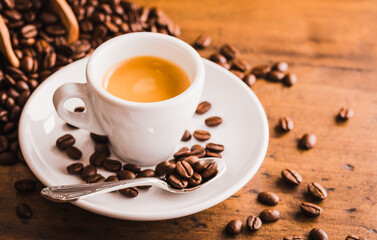 Coffee cup of espresso on wooden table background. Italian traditional coffee cup at cafe.