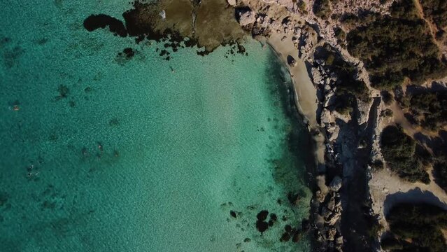 Aerial drone view of the rocky coast and the Mediterranean Sea near the scenic Aphrodite Trail in the Akamas Peninsula National Park, Cyprus. Famous tourist travel destination near Polis city, Cyprus