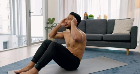 Fitness, sit ups and man training in his home exercising his abdominal, belly and strong stomach muscles on an apartment floor. Calisthenics, healthy and young athlete busy with workout and exercise