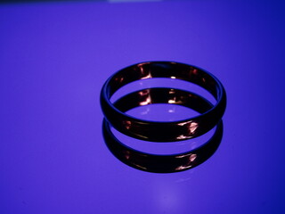 Rings with fire reflection on blue background