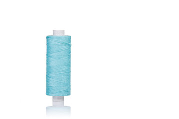 a skein of threads of blue color macro on a white background