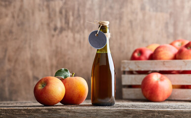 Apple vinegar on wooden background