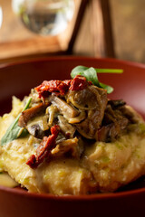 mashed potatoes with beef stroganoff in a beautiful restaurant serving