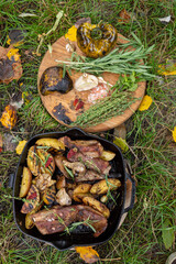Grilled ribs with garlic peppers and herbs with potato