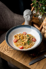 Juicy risotto with seafood in a restaurant serving
