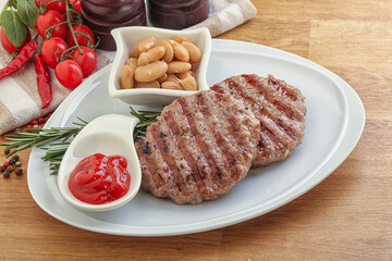 Grilled beef burger cutlet with sauce