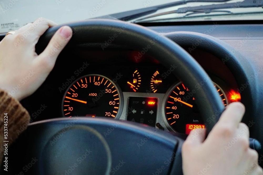 Sticker car dashboard and drivers hand close up