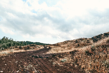 Panoramic wide view of colorful summits of active volcano Etna, Tallest volcano in Continental...