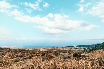 Panoramic wide view of colorful summits of active volcano Etna, Tallest volcano in Continental...