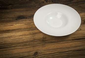 Empty Plate on White Wooden Table with Copy Space