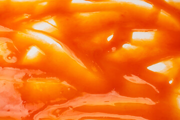 Red sauce splashes as background.
