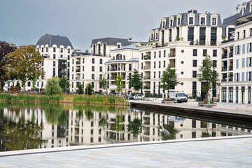 Modern architecture of apartment buildings in a residential area on a lake 