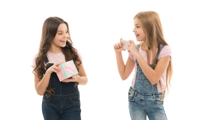 Vlog online stream and channel. Kid hold gift box. Unboxing birthday gifts. Taking mobile photo. How make professional unboxing. Girls cute kids shooting unboxing video on smartphone camera