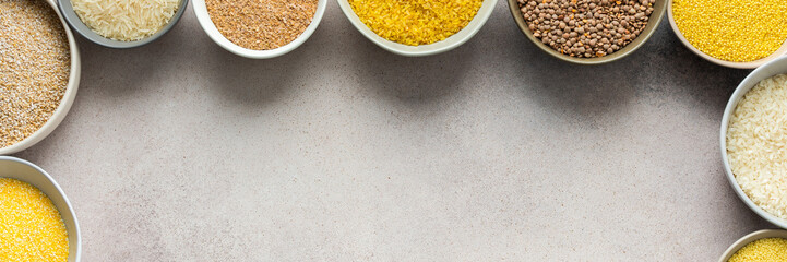 Various grain cereals in bowls banner, top view