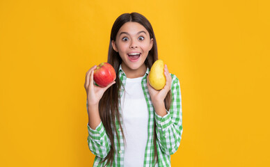 Fototapeta na wymiar surprised kid with apple and pear on yellow background