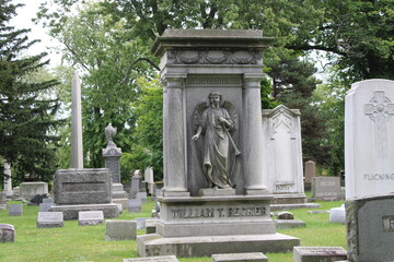 Fototapeta na wymiar Stone Monuments In A Cemetery. 