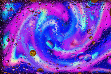 Abstract colorful swirled oil on water surface