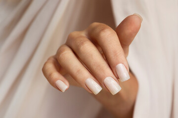 Light milky manicure on square shaped nails.