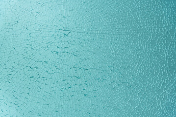 Aquamarine colored broken glass sheet
Great texture of a shattered glass
