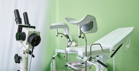 Gynecological chair and colposcope device for examination - obrazy, fototapety, plakaty