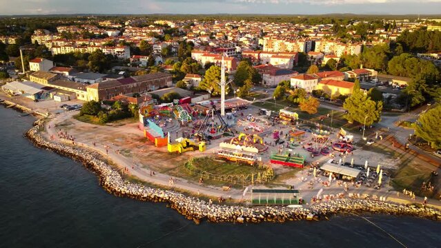 Drone view of a beautiful island with old buildings during sunset