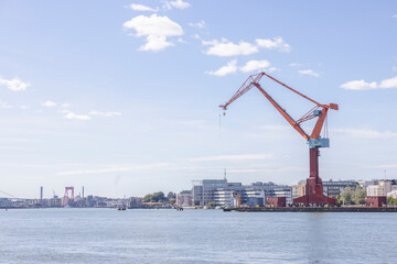 Fototapeta premium Gothenburg harbor with traffic and activity - cranes and ships/boats, Sweden,Scandinavia,Europe
