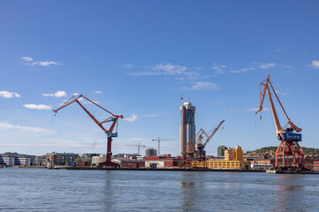Fototapeta na wymiar Gothenburg harbor with traffic and activity - cranes and ships/boats, Sweden,Scandinavia,Europe