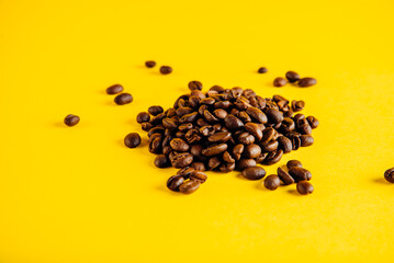 Coffee beans on a yellow background. Bright coffee
