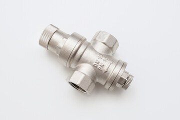 Water flow regulator, pressure reducer valve on white background, new repair part for plumbing, water supply in a house