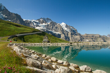 Stunning mountain lake in Swiss Alps. Beautiful mountain landscape in Switzerland above Grindelwald and Eiger mountain