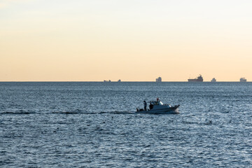 Obraz premium small fishing boat at sea. 
