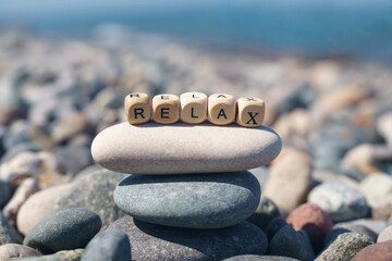 On the stone pyramid there are wooden cubes with the inscription - relax.
