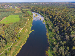 Fototapeta na wymiar Flight over the river, river in the forest from a bird eye view