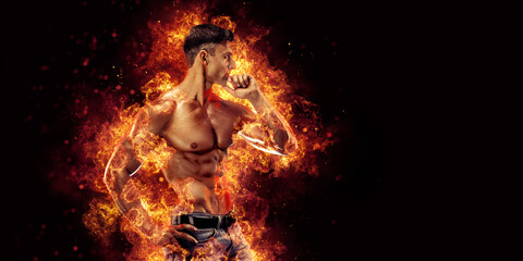 Obraz na płótnie Canvas Bodybuilder posing on the fire flames background