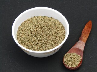 Carom seed or ajwain in a bowl on black background 