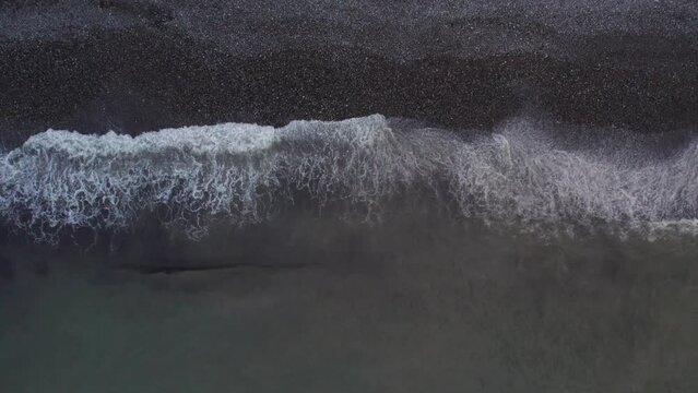 Birds eye top down view along black sand beach Batumi Georgia. High quality 4k aerial top down footage